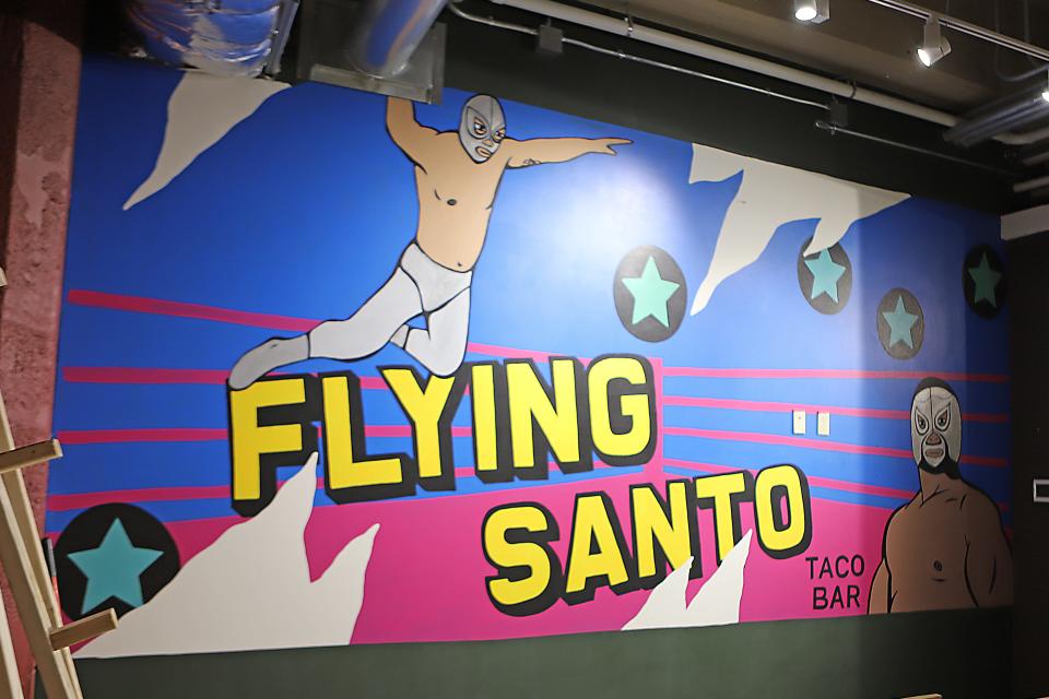 Flying Santo taco bar is a new restaurant that will open in later this summer in the Jones421 Building in downtown Sioux Falls. The mural was painted by Jillian Artistry as construction continues on the inside of the space. One of the owners, Abe Castro, said he is considering joining the Hispanic Chamber of Commerce.