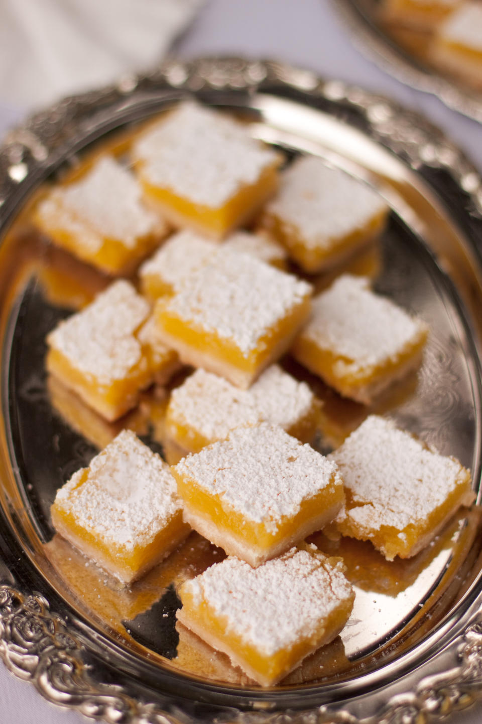 Tray of lemon bars with powdered sugar on top