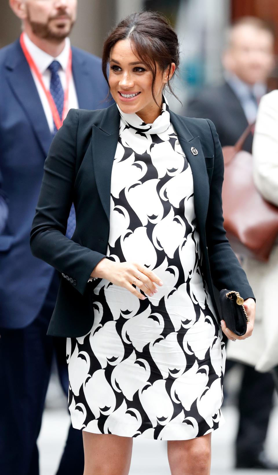 Meghan Markle wears a black and white minidress in 2019.