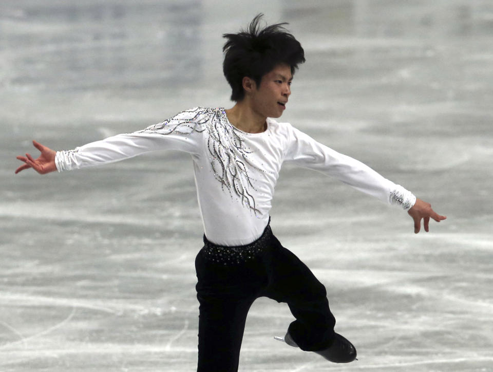 Tatsuki Machida of Japan performs during a men's short program of the World Figure Skating Championships in Saitama, near Tokyo, Wednesday, March 26, 2014. (AP Photo/Koji Sasahara)