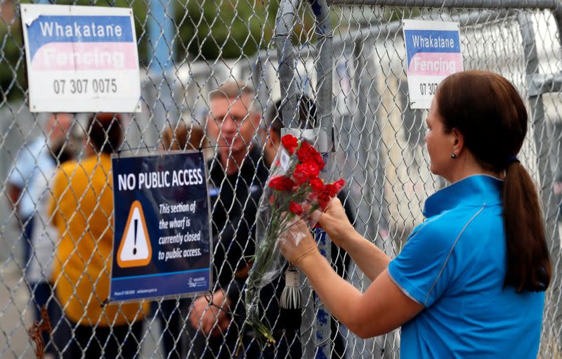 Relatives wait for rescue mission, following the White Island volcano eruption in Whakatane