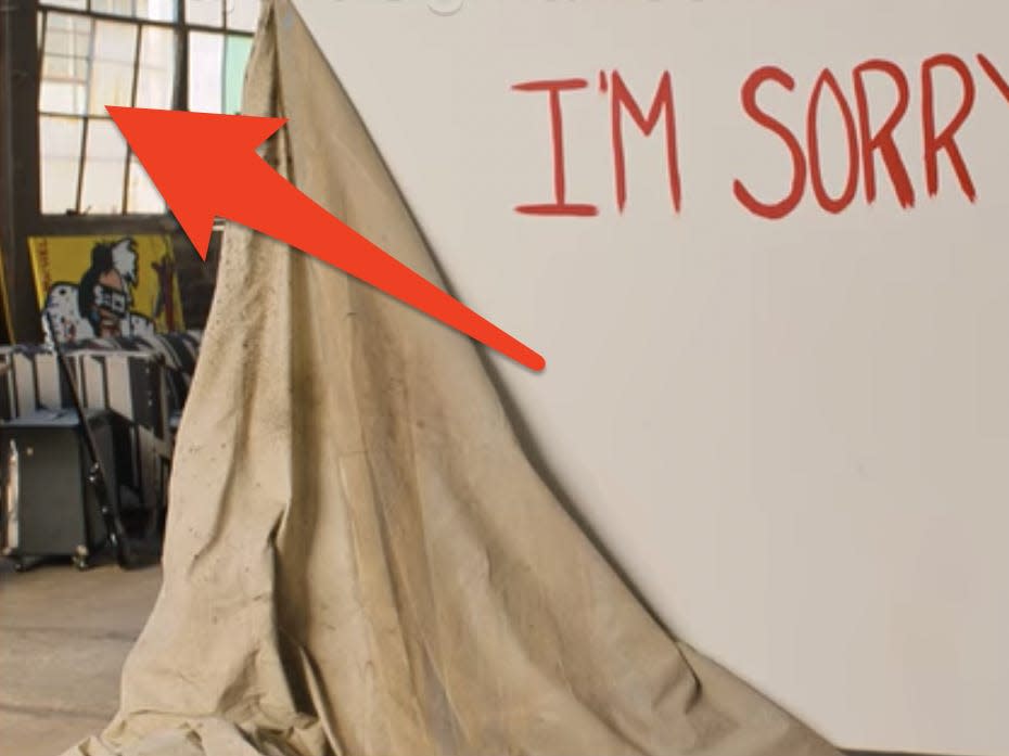 arrow pointing to open window in russ' warehouse behind drea and her i'm sorry sign in do revenge