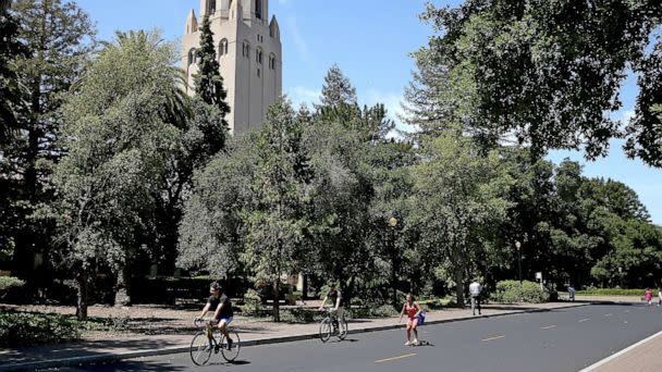 PHOTO: People ride bikes past Hoover Tower on the Stanford University campus on May 22, 2014 in Stanford, Calif. (Justin Sullivan/Getty Images, FILE)