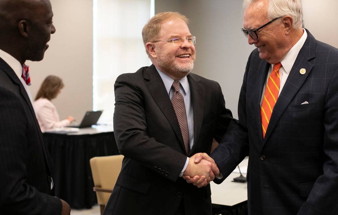 UNC System President-elect Peter Hans shakes hands with Board of Governors member Leo Daughtry following their meeting on June 19, 2020, in Chapel Hill.