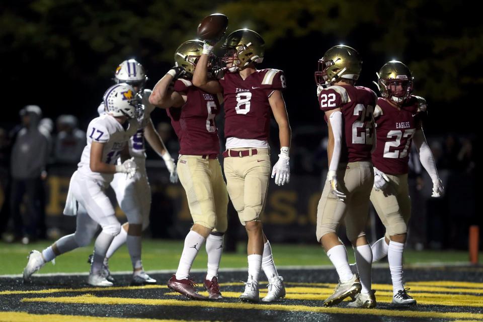 Watterson's Ryan Rudzinski (8) celebrates with teammate Dominic Purcell (6) after a touchdown reception against DeSales on Oct. 7 at Ohio Dominican University in Columbus.