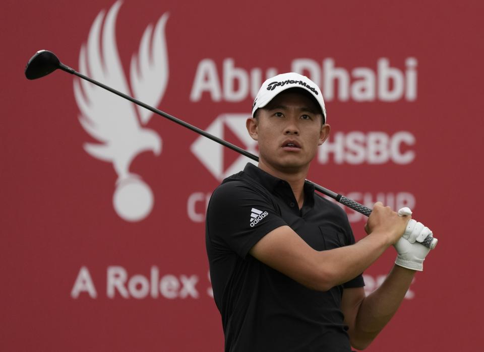 Collin Morikawa from the U.S. follows his ball on the 10th hole during the first round of the Abu Dhabi Championship golf tournament at the Yas Links Golf Course, in Abu Dhabi, United Arab Emirates, Thursday, Jan. 20, 2022. (AP Photo/Kamran Jebreili)