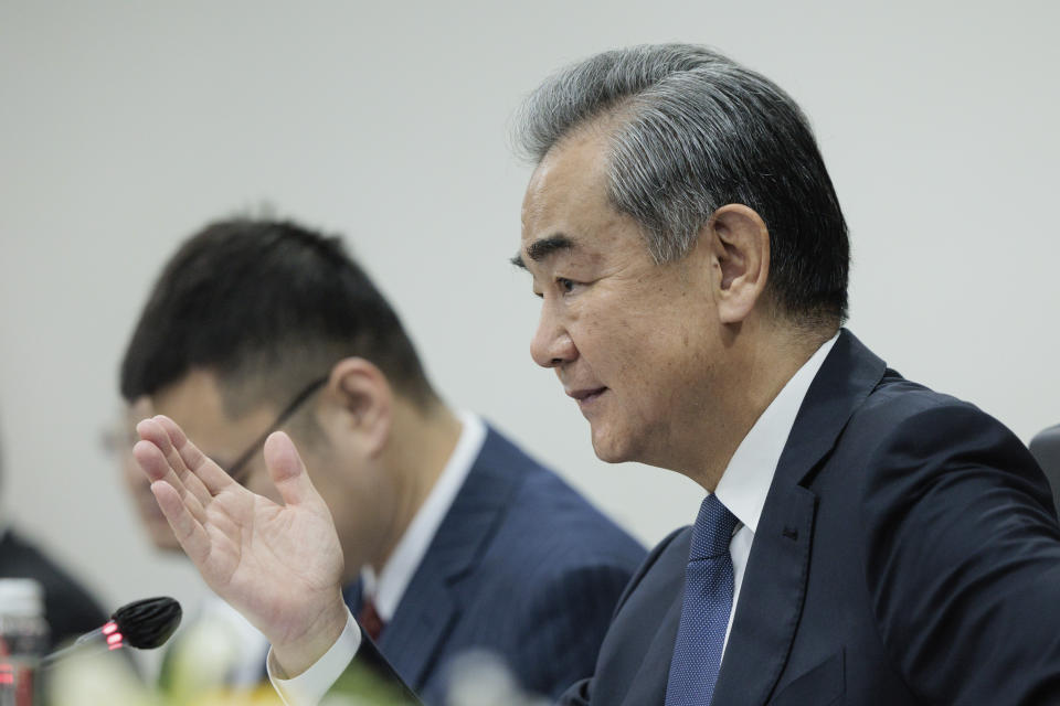 Chinese Foreign Minister Wang Yi gestures as he speaks during his bilateral meeting with Indonesian Foreign Minister Retno Marsudi in Jakarta, Indonesia, Thursday, April 18, 2024. (Yasuyoshi Chiba/Pool Photo via AP)