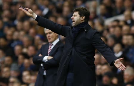 Britain Soccer Football - Tottenham Hotspur v Stoke City - Premier League - White Hart Lane - 26/2/17 Tottenham manager Mauricio Pochettino gestures during the match as Stoke City manager Mark Hughes looks on Action Images via Reuters / Peter Cziborra Livepic