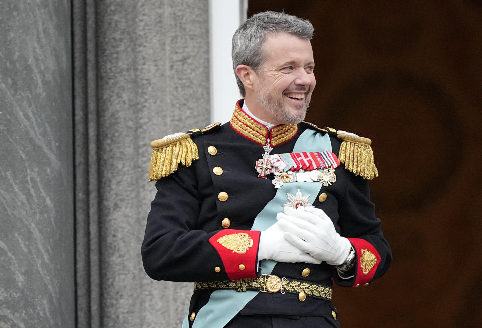 Denmark's King Frederik X reacts as he stands on the balcony of Christiansborg Palace in Copenhagen, Denmark, Sunday, Jan. 14, 2024. Queen Margrethe II has become Denmark's first monarch to abdicate in nearly 900 years when she handed over the throne to her son, who has become King Frederik X. (AP Photo/Martin Meissner)