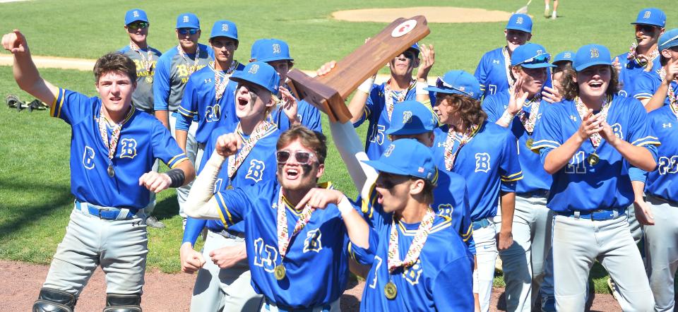 The Clear Spring Blazers come over to show their state championship trophy to their fans after defeating Colonel Richardson 11-3 for the Class 1A baseball title on May 28 at Regency Furniture Stadium in Waldorf.