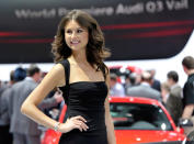 A model stands near the Audi display on the first press preview day for the North American International Auto Show in Detroit, Michigan, January 9, 2012. REUTERS/Mike Cassese