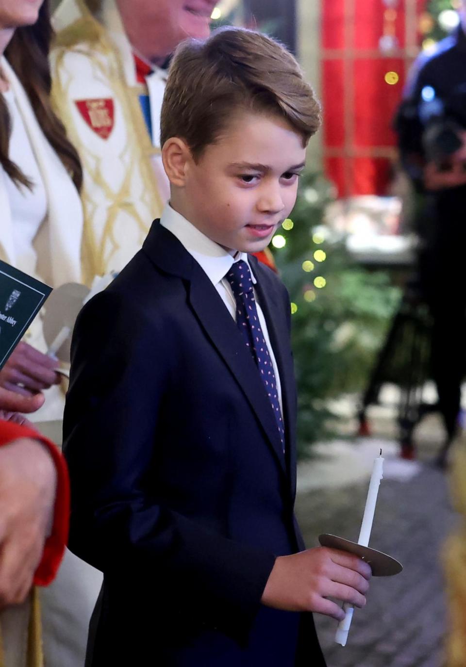 PHOTO: Prince George of Wales holds a candle as he leaves with his family at The 'Together At Christmas' Carol Service at Westminster Abbey, on Dec. 8, 2023, in London. (Chris Jackson/Getty Images)