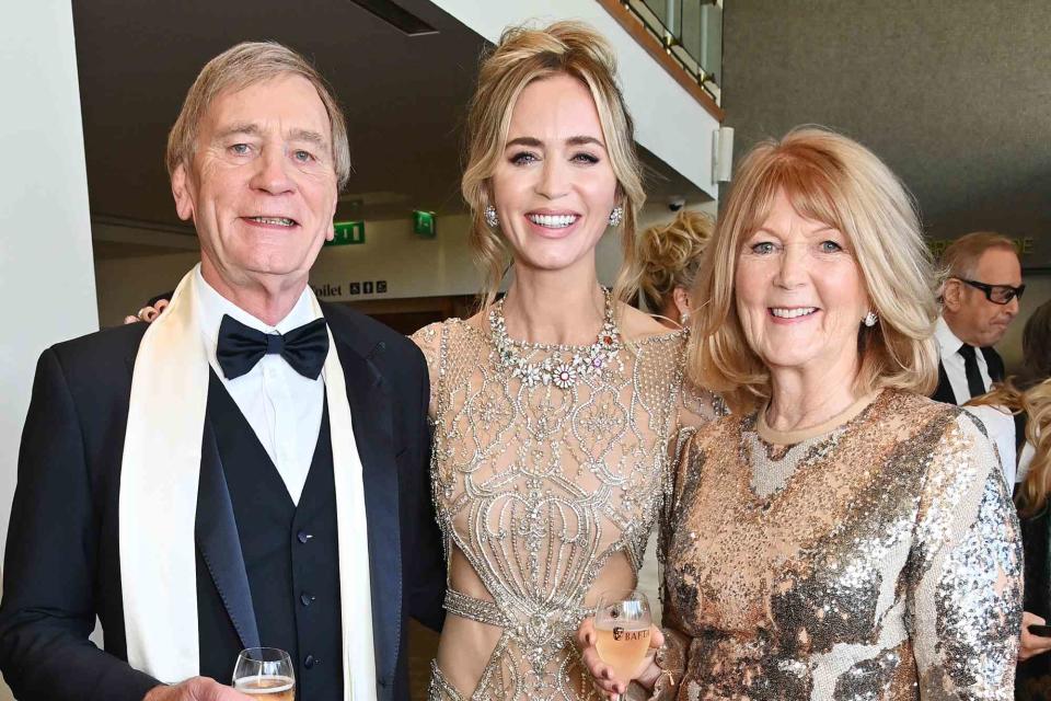 <p>Dave Benett/BAFTA/Getty</p> Emily Blunt poses with parents Oliver Blunt and Joanna Blunt at the EE BAFTA Film Awards 2024 on February 18, 2024 in London, England.  