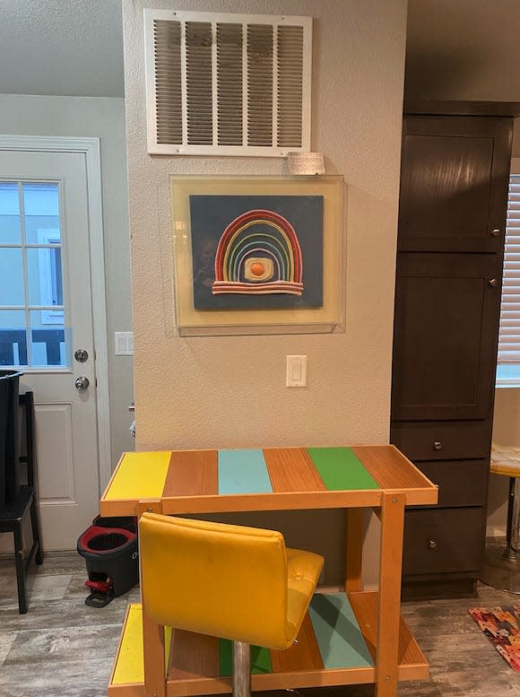 ikea table and art piece in mobile home