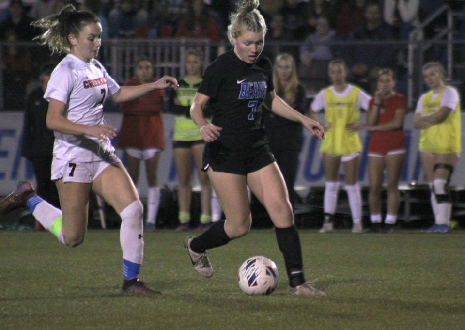 Bartram Trail midfielder Carolyn Johnson (7, right) dribbles away from Creekside midfielder Hayden Petrick (7) and prepares to strike the opening goal  in the FHSAA Region 1-7A high school girls soccer final on February 14, 2023. [Clayton Freeman/Florida Times-Union]