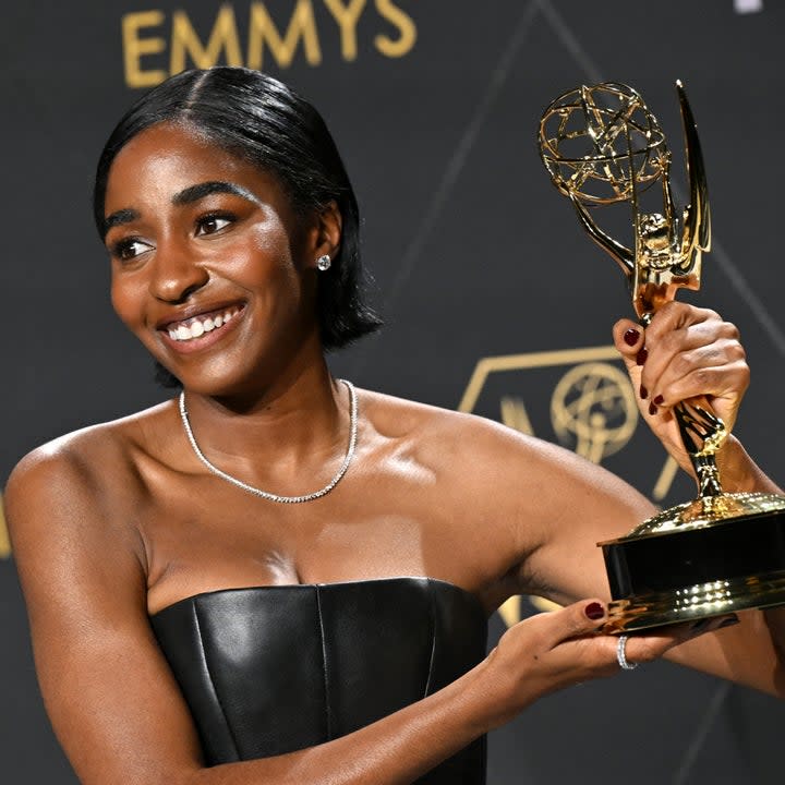 Closeup of Ayo Edebiri holding her Emmy