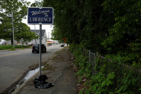 A sign marks the town line in Lawrence, Massachusetts, U.S., May 30, 2017, where individuals were arrested earlier in the day during raids to break up heroin and fentanyl drug rings in the region, according to law enforcement officials. REUTERS/Brian Snyder