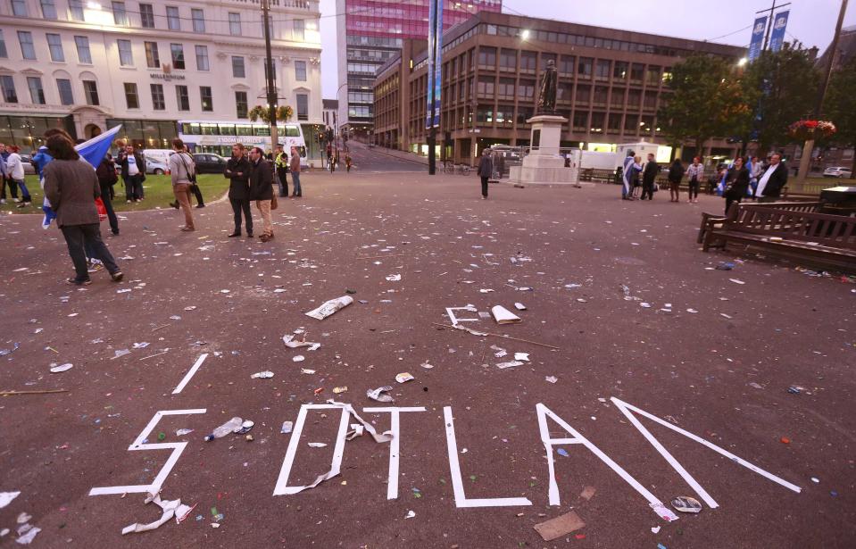 The remnants of a message written in tape by "Yes" campaign is seen in George Square after Scotland voted against becoming an independent country, in Glasgow