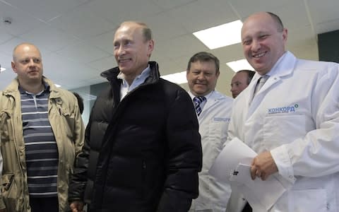 Yevgeny Prigozhin, right, with Russian President Vladimir Putin at his school meals factory in 2010 outside St Petersburg - Credit: Alexei Druzhinin/Sputnik via AP