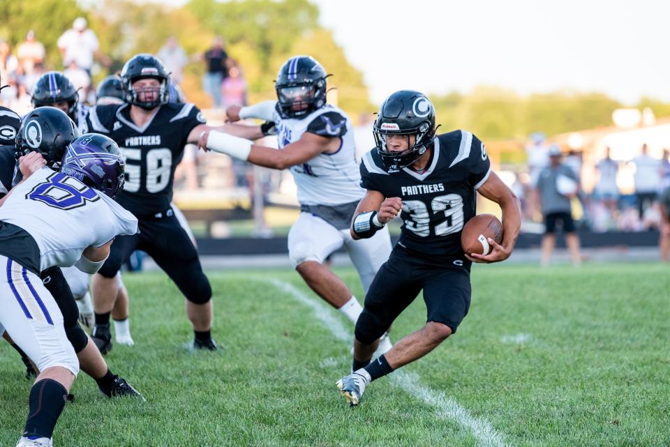 Centralia's Kyden Wilkerson (33) looks for a running lane during the Panthers' 26-20 win over Hallsville last Friday night.