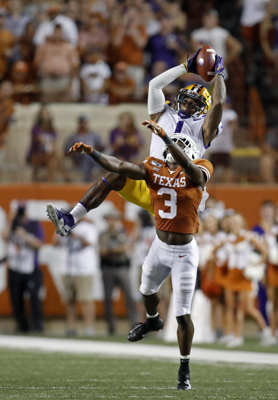 LSU Tigers wide receiver Ja'Marr Chase #1, catches a pass over Texas Longhorns defensive back Jalen Green #3, Saturday Sept. 7, 2019 at Darrell K Royal-Texas Memorial Stadium in Austin, Tx. LSU won 45-38. ( Photo by Edward A. Ornelas )