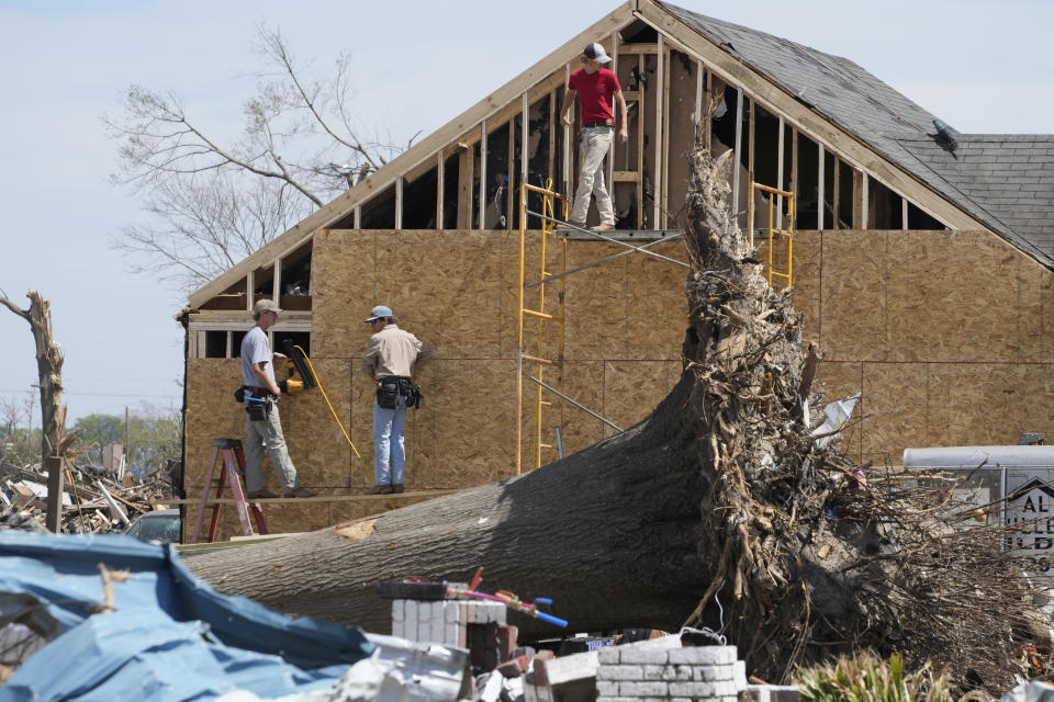 Work crews rebuild the walls to this Rolling Fork, Miss., home following the March 24 killer tornado destroyed much of the small town and also hit a number of Mississippi communities, on March 29, 2023. Many communities are in the midst of cleanup. (AP Photo/Rogelio V. Solis)