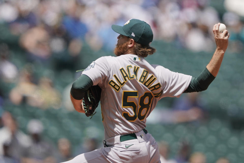 Oakland Athletics starting pitcher Paul Blackburn throws against the Seattle Mariners during the first inning of a baseball game, Wednesday, May 25, 2022, in Seattle. (AP Photo/Ted S. Warren)