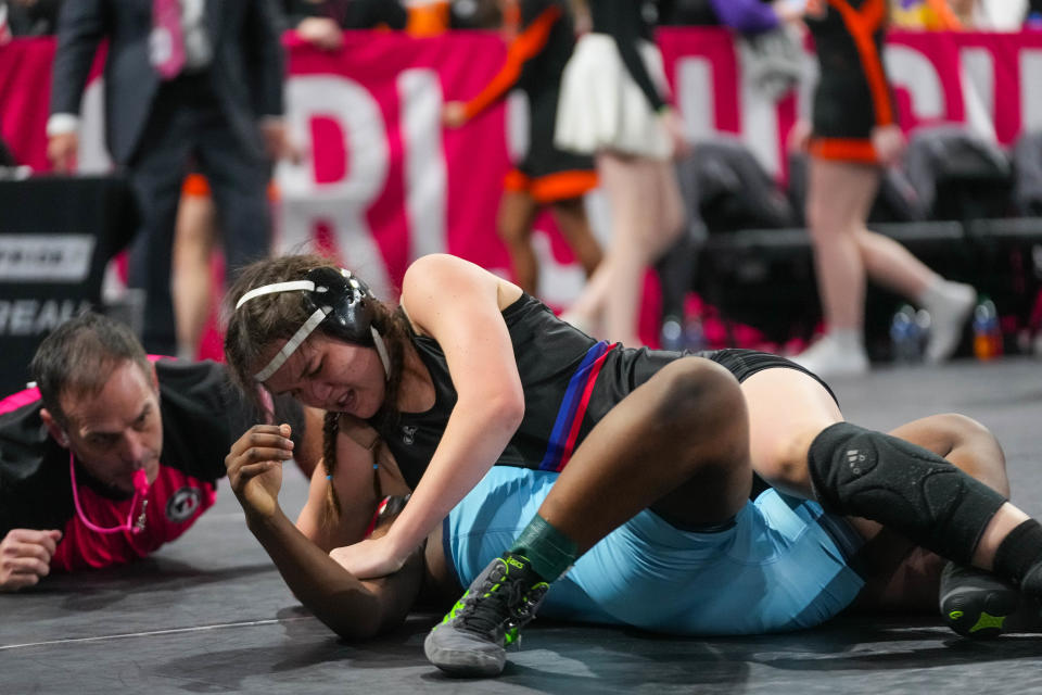 Raccoon River-Northwest’s Naomi Templeman, top, wrestles Cedar Rapids Jefferson’s Josephine Budederi at 140 pounds during the first round of consolation at the Iowa Girl’s state wrestling tournament.