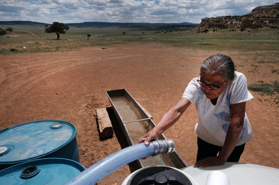 <span class="caption">In some drought-stricken parts of the Southwest, water arrives by truck.</span> <span class="attribution"><a class="link " href="https://www.gettyimages.com/detail/news-photo/an-elderly-member-of-the-navajo-nation-receives-her-monthly-news-photo/1154270592" rel="nofollow noopener" target="_blank" data-ylk="slk:Spencer Platt/Getty Images;elm:context_link;itc:0;sec:content-canvas">Spencer Platt/Getty Images</a></span>