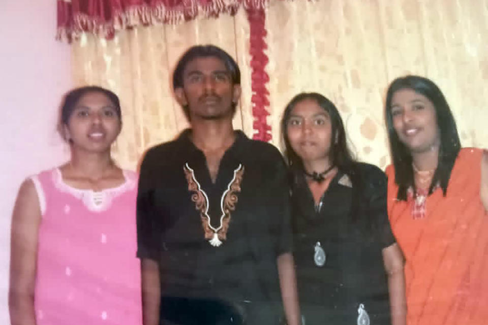 This undated photo provided by Sarmila Dharmalingam, right, shows her younger brother Nagaenthran K.Dharmalingam, second from left, with their cousins in Ipoh, Malaysia. Singapore is due to hang the Malaysian man next week for smuggling a small amount of heroin into the country, but legal and human rights groups are urging the execution be halted because the man is intellectually disabled. (Courtesy of Sarmila Dharmalingam via AP)