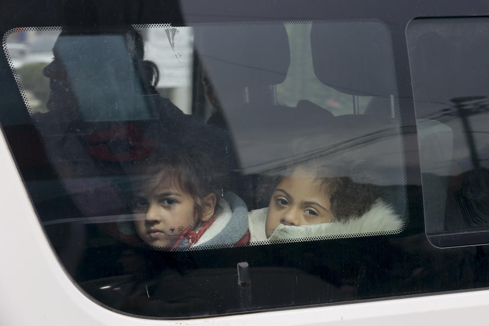 FILE - Ethnic Armenian children from Nagorno-Karabakh look through a car window upon their arrival in Goris, the town in Syunik region, Armenia, Sept. 25, 2023. Thousands of Nagorno-Karabakh residents are fleeing their homes after Azerbaijan's swift military operation to reclaim control of the breakaway region after a three-decade separatist conflict. (AP Photo/Vasily Krestyaninov, File)