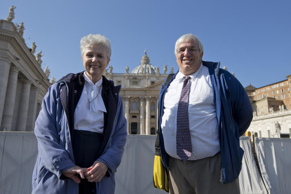 FILE - Sister Jeannine Gramick, left, and Francis DeBernardo, executive director of the Catholic gay rights group New Ways Ministry, pose for a photo in front of St. Peter's Basilica, at the Vatican, after attending Pope Francis' weekly general audience, Wednesday, Feb. 18, 2015. In June 2023, Gramick publicly shared a letter she wrote to the Los Angeles Dodgers, welcoming their re-invitation of the Sisters of Perpetual Indulgence drag group to the team’s Pride Night, and saying its members deserved recognition for their charity work. “While I am uncomfortable with the Sisters of Perpetual Indulgence using the nuns’ old garb to draw attention to bigotry, whether Catholic or not, there is a hierarchy of values in this situation,” Gramick wrote. (AP Photo/Andrew Medichini, File)