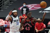 Toronto Raptors forward Pascal Siakam (43) loses the basketball as he tries to drive around Dallas Mavericks center Willie Cauley-Stein (33) during the second half of an NBA basketball game Monday, Jan. 18, 2021, in Tampa, Fla. (AP Photo/Chris O'Meara)