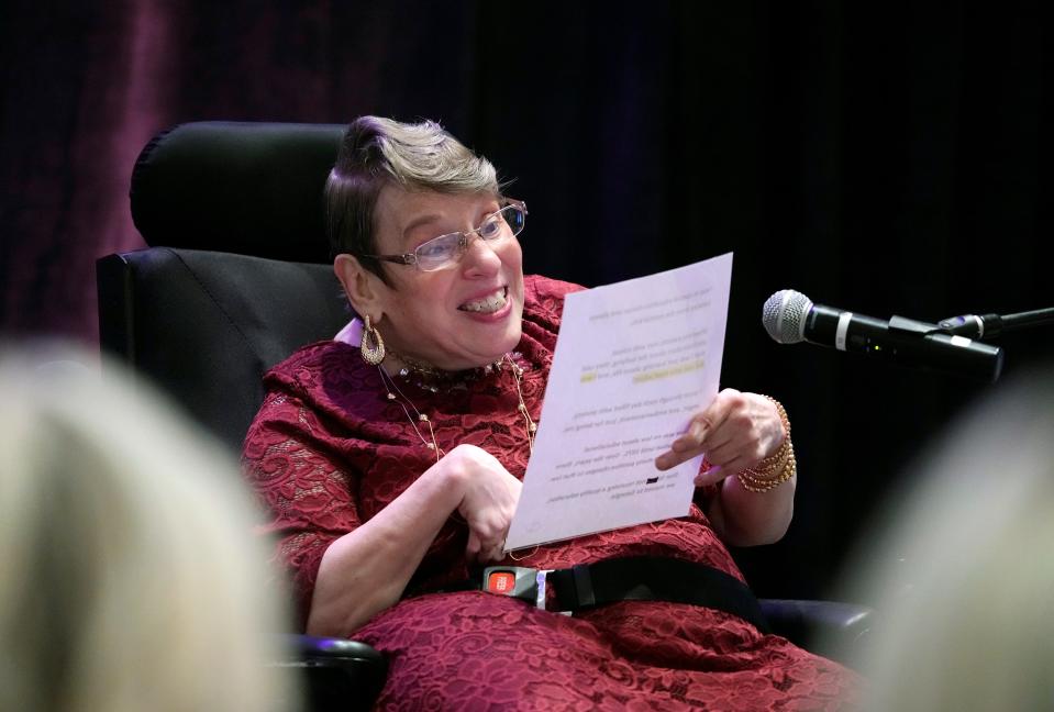 Duvall Homes resident and disability advocate Margret "Meg" Hanky reads from a script as she delivers the keynote address at the Women United Volusia's 19th annual Power of the Purse charity fundraiser luncheon at the Hilton Daytona Beach Oceanfront Resort on Friday, Aug. 9, 2022.