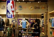 A sales assistant is seen in an NBA Playzone store at a shopping mall in Beijing