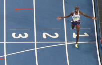 2016 Rio Olympics - Athletics - Final - Men's 5000m Final - Olympic Stadium - Rio de Janeiro, Brazil - 20/08/2016. Mo Farah (GBR) of Britain crosses the finish line to win the gold. REUTERS/Pawel Kopczynski