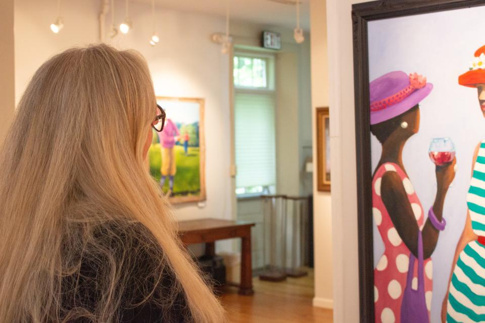 Jill Swersie looks at work in the JUST JILLS art exhibit at the Antoine Dutot Museum & Gallery in Delaware Water Gap.