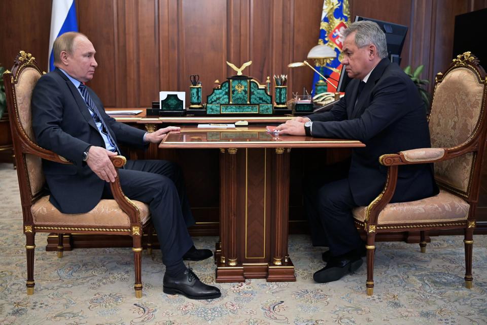 Russian President Vladimir Putin (L) meets with Russian Defence minister Sergei Shoigu in Moscow on January 13, 2022, as Russian-led forces launched their withdrawal from Kazakhstan, where they had been dispatched to support the ruling government in the face of unprecedented rioting, the Russian Defence Ministry announced. (Photo by Alexey NIKOLSKY / SPUTNIK / AFP) (Photo by ALEXEY NIKOLSKY/SPUTNIK/AFP via Getty Images)