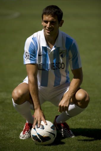 Malaga's new signing, Paraguayan Roque Santa Cruz, poses for a photo during his official presentation at the Rosaleda stadium in Malaga, on September 14. Malaga play Levante next, on Saturday