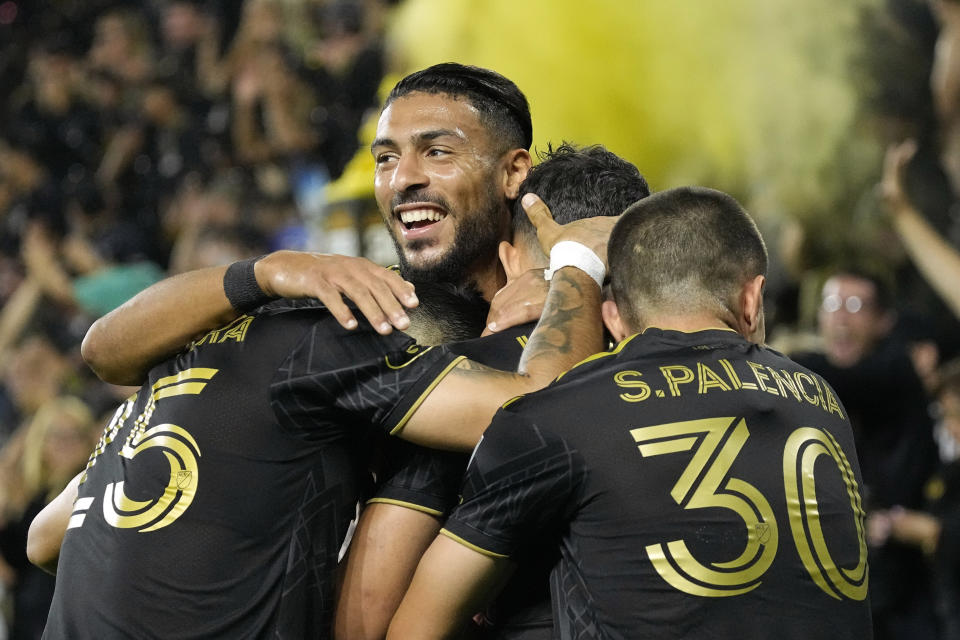 Los Angeles FC midfielder Filip Krastev, second from right, celebrates a goal with Cristian Olivera, Denis Bouanga and Sergi Palencia during a match against Minnesota United on Oct. 4 in Los Angeles. (AP Photo/Mark J. Terrill)