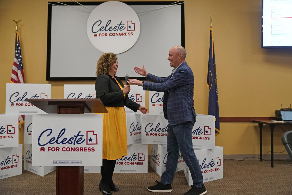 Utah Gov. Spencer Cox hugs Utah 2nd Congressional District Republican nominee Celeste Maloy connect during an election night party at the Utah Trucking Association Tuesday, Nov. 21, 2023, in West Valley City, Utah. (AP Photo/Rick Bowmer)