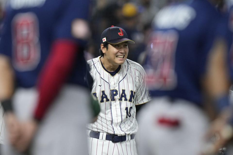 Japan's Shohei Ohtani smiles during the player introduction before the World Baseball Classic championship game