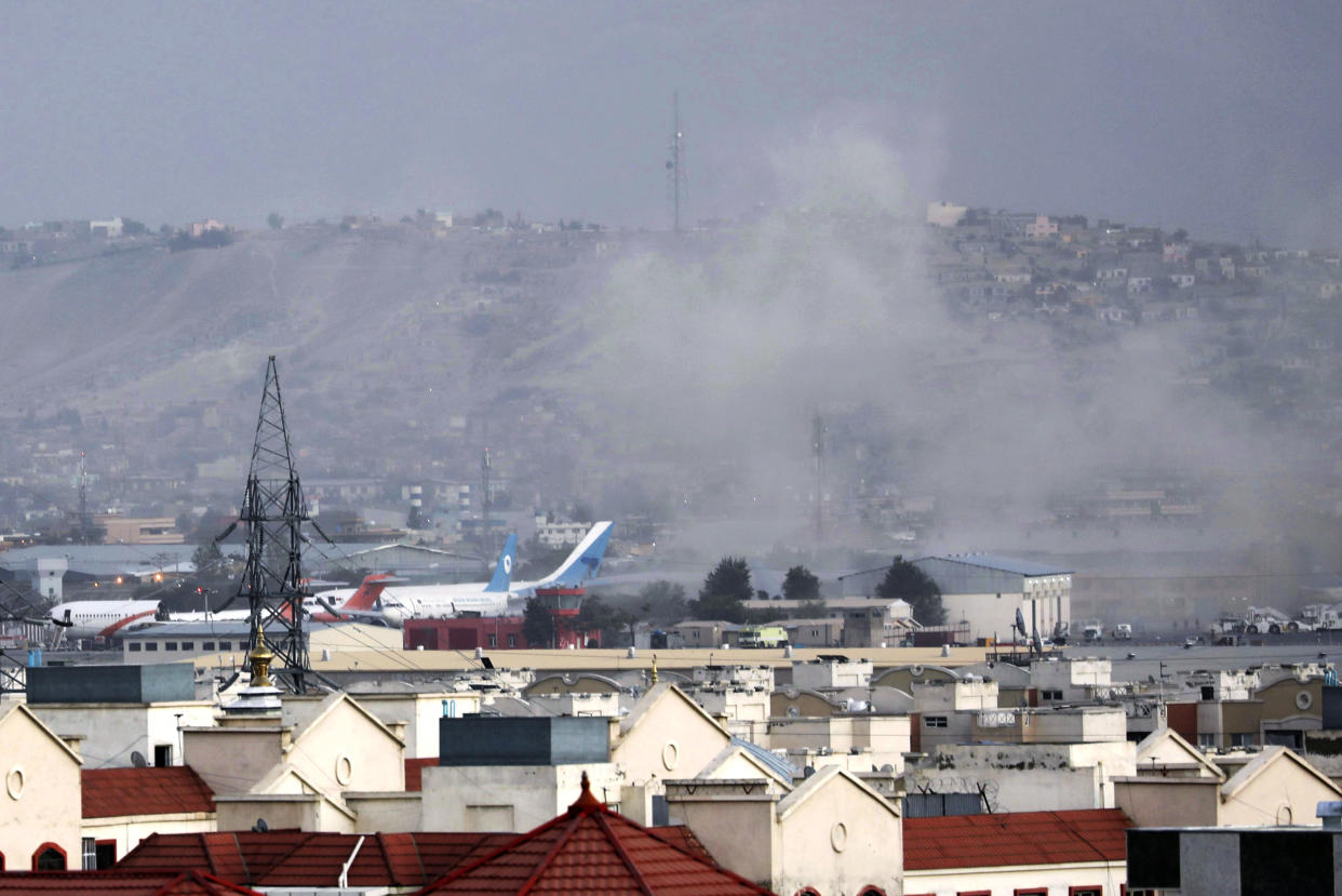 Smoke rises from a deadly explosion outside the airport in Kabul, Afghanistan (Wali Sabawoon / AP file)