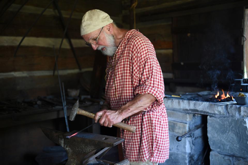 Jack Harvey of Knoxville works as a blacksmith at James White’s Fort during the Knoxville Historic House Museums’ Statehood Day celebration, Saturday, June 3, 2023.