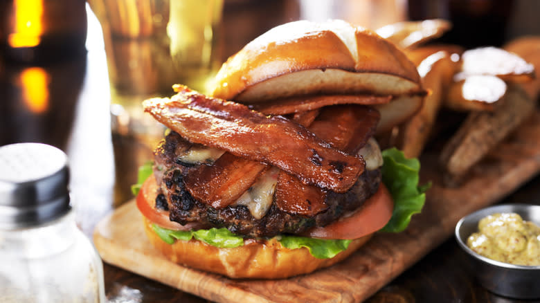 Bacon cheeseburger on pretzel bun