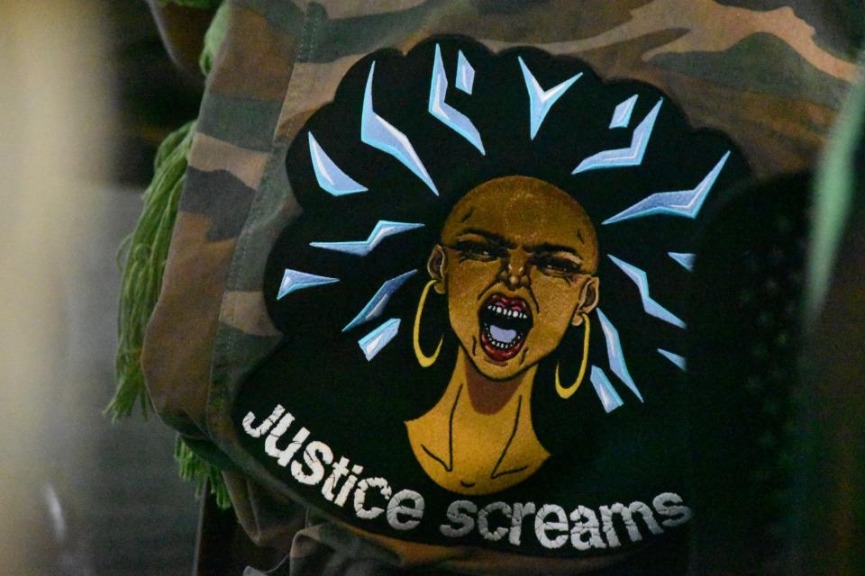 In her activism, Marla Godette operates under the slogan "Justice Screams," pictured above on a jacket. Godette began using the phrase in 2020 after Minneapolis police killed George Floyd.
