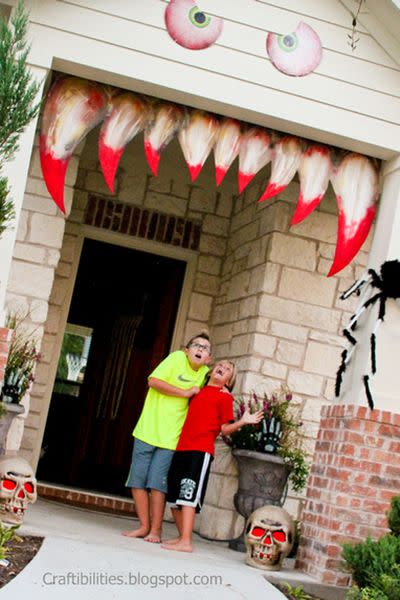 <p>Go all out this Halloween by transforming your entryway or porch into this scary monster </p><p><strong>Get the tutorial at <a href="http://www.craftibilities.com/2013/10/making-your-house-come-alive-halloween.html" rel="nofollow noopener" target="_blank" data-ylk="slk:Craftibilities;elm:context_link;itc:0;sec:content-canvas" class="link ">Craftibilities</a>.</strong></p>