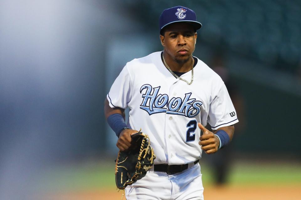 Hooks second baseman Enmanuel Valdez (2) returns to the dugout in a game against the Wichita Wind Surge on Tuesday, May 24, 2022 at Whataburger Field. The Hooks lost 8-3.