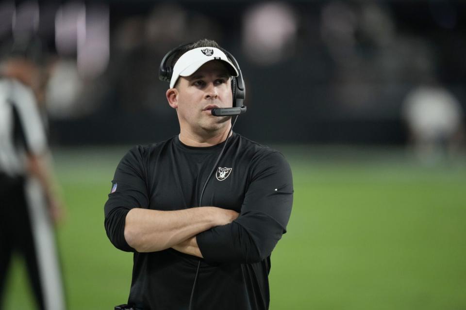 Las Vegas Raiders head coach Josh McDaniels watches from the sideline during a preseason game.