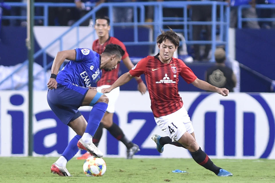 Al Hilal's Salem Al Dawsari, left, fights for the ball with Urawa Reds' Sakine Takahiro during the first leg of the AFC Champions League final soccer match between Al Hilal and Urawa Red at King Fahd stadium in Riyadh, Saudi Arabia, Saturday, Nov. 9, 2019. Al Hilal won 1-0. (AP Photo)